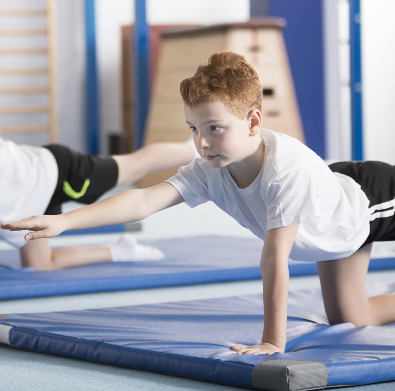 young child in yoga pose
